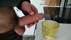 Horny Pig Pisses in a Cup and then Jerks off and Cums in the Piss