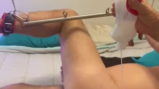 Mistress pegging sub with wrist and ankle locked in spreader bar