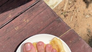 Large Feet Squishing a Banana
