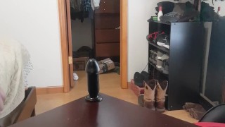 Teen stretches ass on large butt plug.