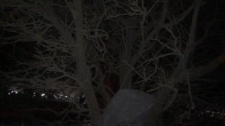 Pissing at a scary night in a public area when people are passing by and cars run along the road