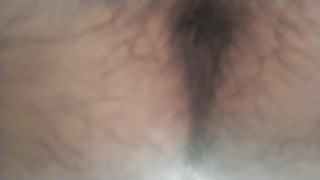A hairy Japanese man squats and masturbates. The contraction of his anus at moment of ejaculation