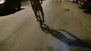 Sexy guy undresses on a public street and rides a bike naked touching his dick - risky
