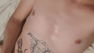 Tattooed guy wanking