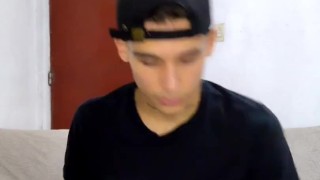 young man masturbates in the living room while the parents do not see him