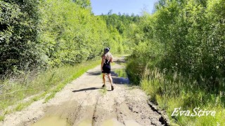 sexy blonde pissing in a puddle on the road