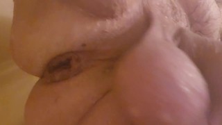 Stretching my cunt with my inflatable plug in the shower.