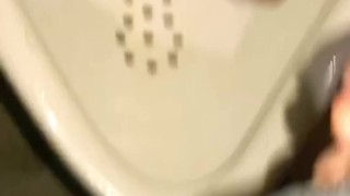 Pissing at a urinal first thing in the morning with my friend dildo 