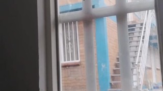 masturbating in the window facing the street