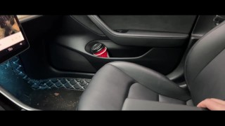 Passenger jerking driver's dick in car in the middle of forest for free ride. Handjob in Tesla