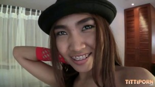 Thai girl with big tits lets a foreign stuff her tiny pussy