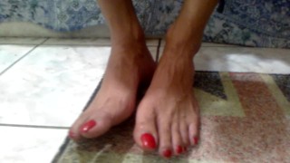 Red long toenails teasing