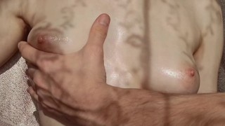 Massage of tender tits in the sun
