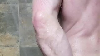 Stud shoots load and rubs cum all over his chest