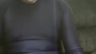 Jacking off condomed dildo with lotion in full blue spandex suit