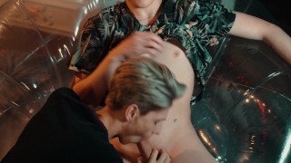 Two sweet guys share an inflatable chair