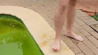 Wanking outside next to swimming pool