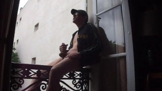 handjob and cum by the window
