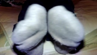 Feet in dirty socks moving around