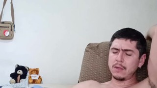 Handsome guy playing with cock and cum