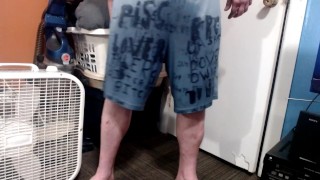 standing pissing in under armour shorts