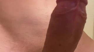 A moaning guy stimulates his big cock and finishes with huge cumshot