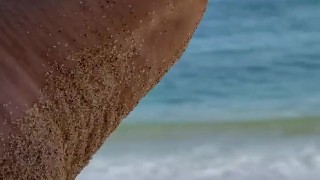 big feet on the sand