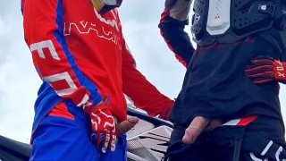 Hot motocross boys cum near motorcycle