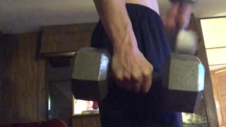 Young stud lifting weights and stripping