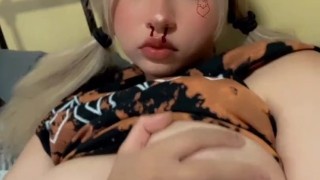 Blonde anime girl plays with her boobs