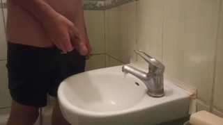 pissing my beautiful circumcised cock in the sink