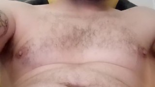 Young tattooed guy stroking