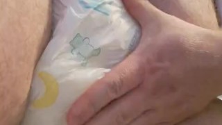 chubby bear rubbing his very wet diaper