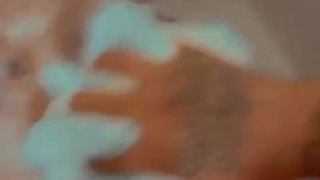 Rubbing my sexy femme down with soap in the shower