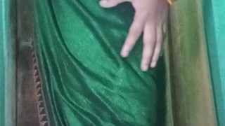 Indian gay Crossdresser Gaurisissy in Green Saree pressing her big Boobs and fingering in her ass