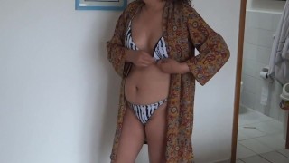 I open my dress to show myself in erotic lingerie and a bikini on the beach