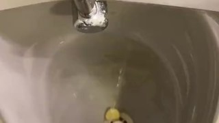 Destructive pissing in public urinal
