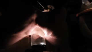 PV TAking Lit Glass Bottle With Head In Back Porch