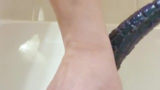 Asian guy moans while riding massive 12" dragon dildo