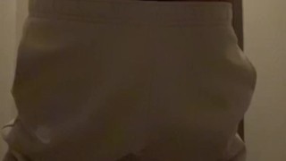 Cheeky guy jerks off a hairy dick in a toilet in sweatpants