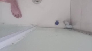 Massaging the dick in the bathtub