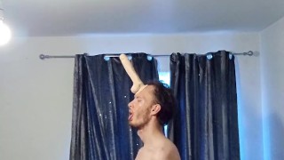 Skinny horny man attaches his big dildo onto his forehead and plays around with his cock