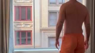 Hotel window in boxers