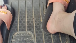 Revving the pedals of my mini Cooper with my pink Adidas slides