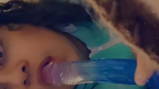 Sucking on a dildo