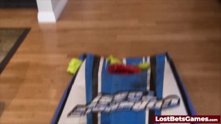 The game of Strip Cornhole Toss transforms into an intense lesbian encounter