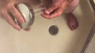 I was so hard while shaving in the shower, started to masturbate and used the water jet to cum