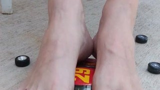 Destroying a model racecar toy with my barefeet smashing it into pieces