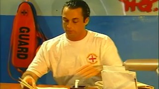 A brunette lifeguard pleases her pussy while working