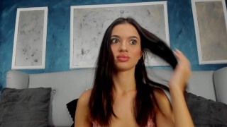 Her intense stare holds an irresistible allure, each slow movement captivating